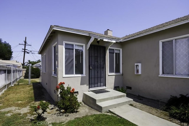 2292 Euclid Ave, Long Beach, CA 90815 - property entrance featuring stucco siding and a chimney
