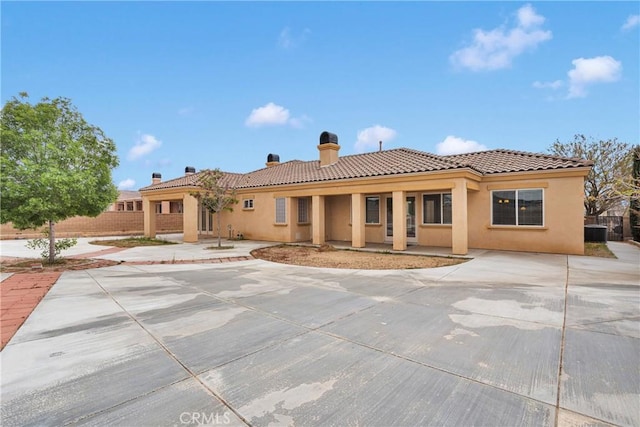 17830 Mana Rd, Apple Valley, CA 92307 - back of property with stucco siding, a chimney, a tiled roof, and central air condition unit