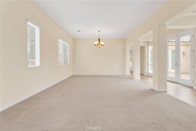 17830 Mana Rd, Apple Valley, CA 92307 - empty room with a chandelier, light colored carpet, french doors, and baseboards