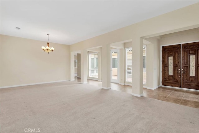 17830 Mana Rd, Apple Valley, CA 92307 - foyer entrance featuring a chandelier, carpet, and baseboards