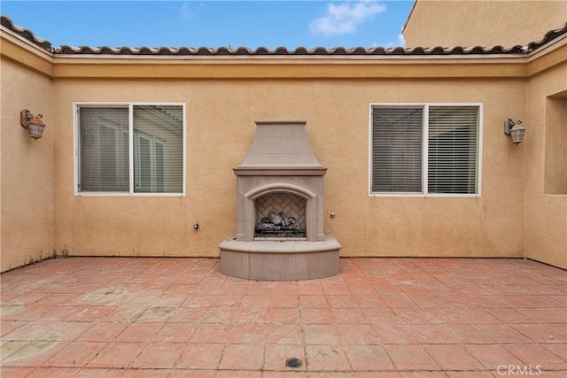 17830 Mana Rd, Apple Valley, CA 92307 - view of patio featuring a tile fireplace