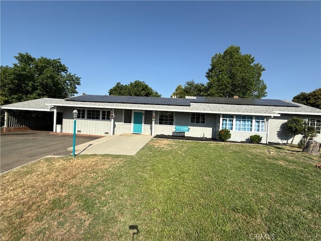 149 Acacia Ave, Oroville, CA 95966 - single story home with a front yard, roof mounted solar panels, and an attached carport