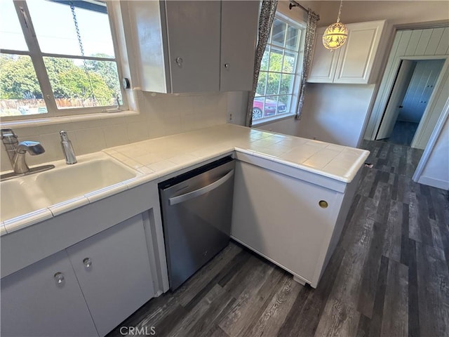 149 Acacia Ave, Oroville, CA 95966 - kitchen featuring dishwasher, dark wood finished floors, white cabinetry, and decorative backsplash