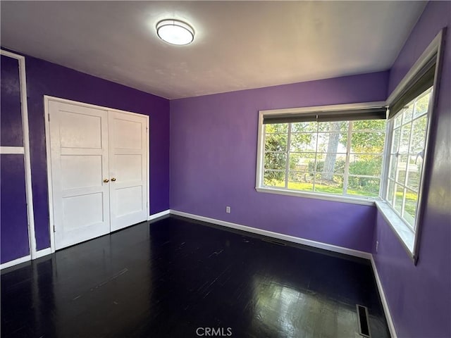 149 Acacia Ave, Oroville, CA 95966 - unfurnished bedroom featuring baseboards, dark wood-style floors, and a closet