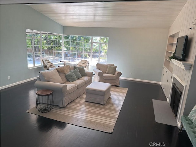 149 Acacia Ave, Oroville, CA 95966 - living room with baseboards, wood ceiling, built in features, a fireplace with flush hearth, and wood finished floors