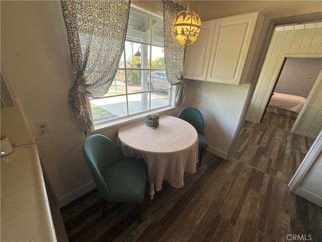 149 Acacia Ave, Oroville, CA 95966 - dining room featuring dark wood-type flooring and baseboards