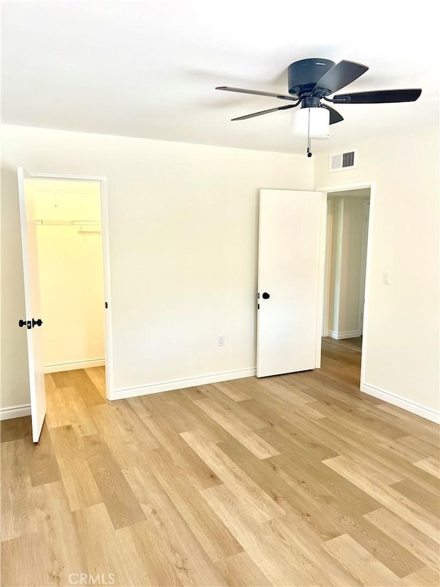 29041 Desert Hills Rd, Menifee, CA 92586 - empty room featuring light wood-style floors and a ceiling fan