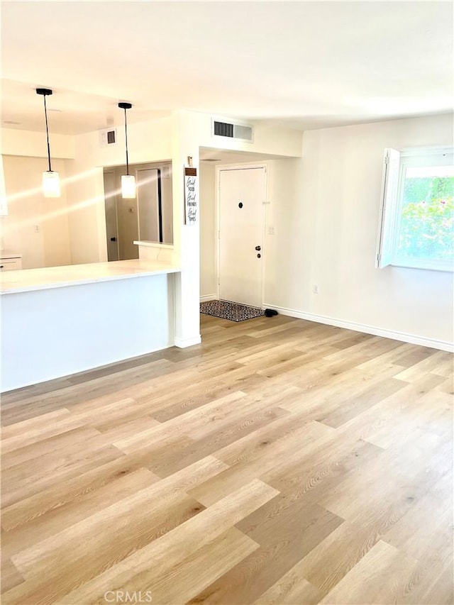 29041 Desert Hills Rd, Menifee, CA 92586 - unfurnished living room with wood finished floors and baseboards