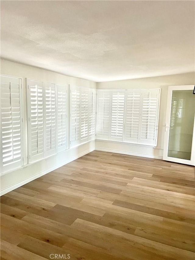 29041 Desert Hills Rd, Menifee, CA 92586 - unfurnished room featuring wood finished floors
