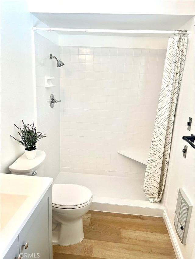 29041 Desert Hills Rd, Menifee, CA 92586 - bathroom featuring vanity, wood finished floors, and tiled shower