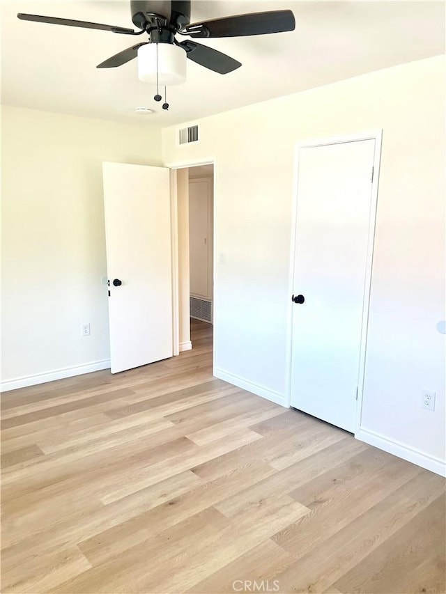 29041 Desert Hills Rd, Menifee, CA 92586 - unfurnished bedroom featuring light wood-style floors and ceiling fan