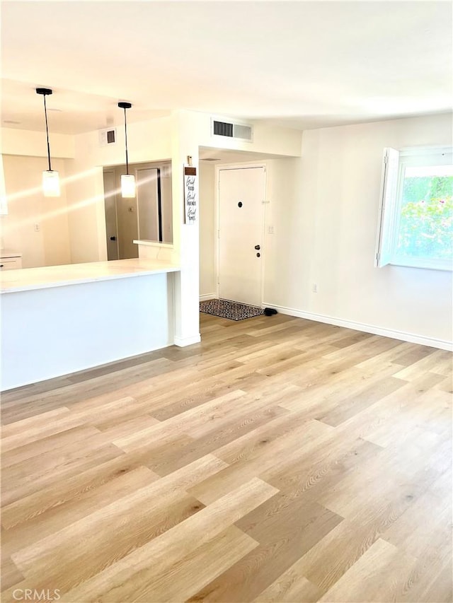 29041 Desert Hills Rd, Menifee, CA 92586 - unfurnished living room with wood finished floors and baseboards