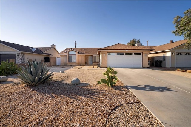 2061 Matthew Ave, Rosamond, CA 93560 - ranch-style house with an attached garage, concrete driveway, and stucco siding