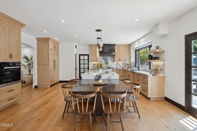 4548 Valley Spring Dr, Westlake Village, CA 91362 - dining space with light wood-style floors, recessed lighting, and arched walkways