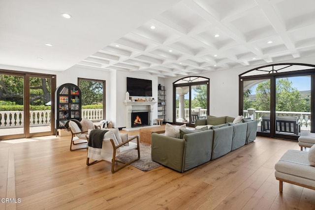 4548 Valley Spring Dr, Westlake Village, CA 91362 - living area with recessed lighting, beamed ceiling, a lit fireplace, coffered ceiling, and light wood-style flooring