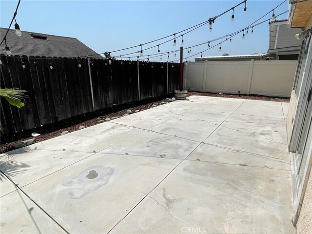 1186 Runaway Cir, Colton, CA 92324 - fenced backyard featuring a patio area