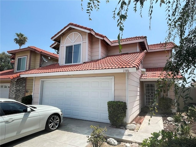 1186 Runaway Cir, Colton, CA 92324 - mediterranean / spanish-style house with a tile roof, driveway, and a garage