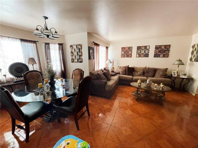 1186 Runaway Cir, Colton, CA 92324 - tiled dining area with a chandelier and a textured ceiling