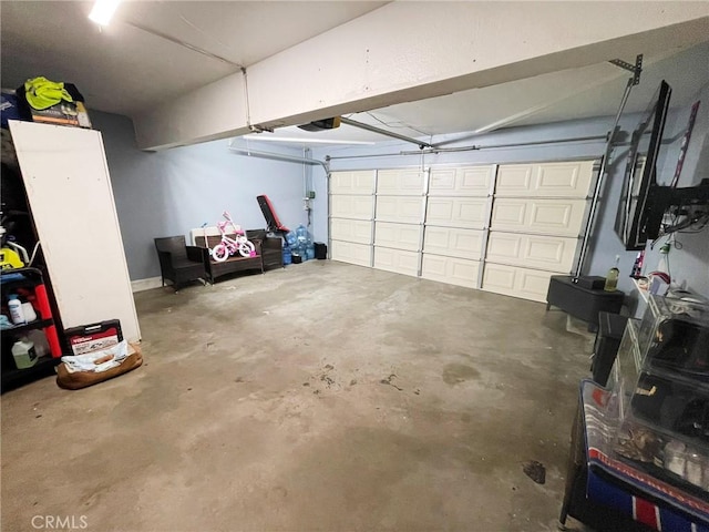 1186 Runaway Cir, Colton, CA 92324 - garage featuring a garage door opener