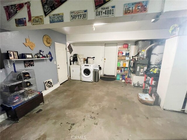 1186 Runaway Cir, Colton, CA 92324 - garage featuring washer and clothes dryer and heating unit