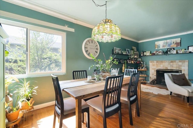 646 Downer Ave, El Cajon, CA 92020 - dining room featuring crown molding, wood finished floors, and a fireplace