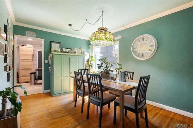646 Downer Ave, El Cajon, CA 92020 - dining space featuring light wood-type flooring and ornamental molding