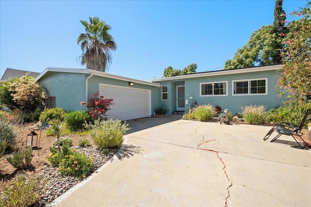 646 Downer Ave, El Cajon, CA 92020 - ranch-style home with stucco siding, an attached garage, and driveway