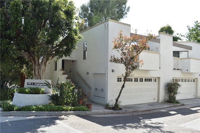 190 N Singingwood St Unit 1, Orange, CA 92869 - view of front of home featuring a garage and stucco siding