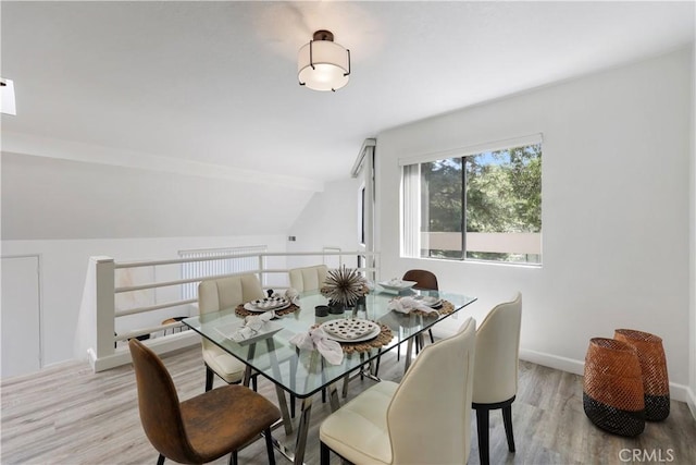 190 N Singingwood St Unit 1, Orange, CA 92869 - dining room with light wood-style floors and lofted ceiling