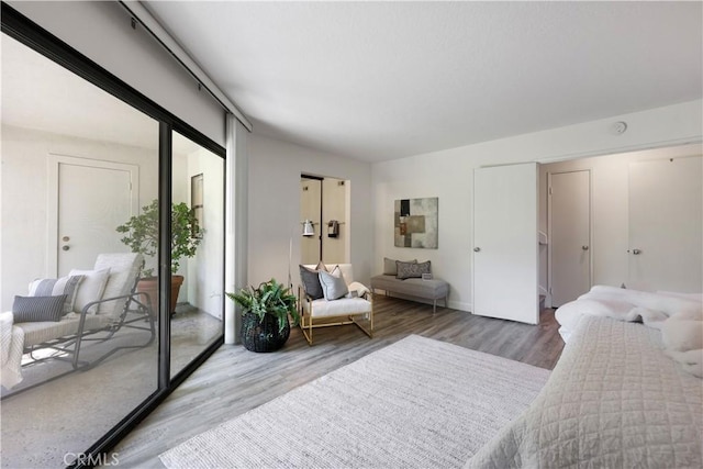 190 N Singingwood St Unit 1, Orange, CA 92869 - bedroom featuring access to outside and wood finished floors