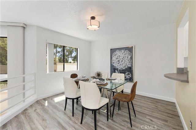 190 N Singingwood St Unit 1, Orange, CA 92869 - dining area featuring wood finished floors