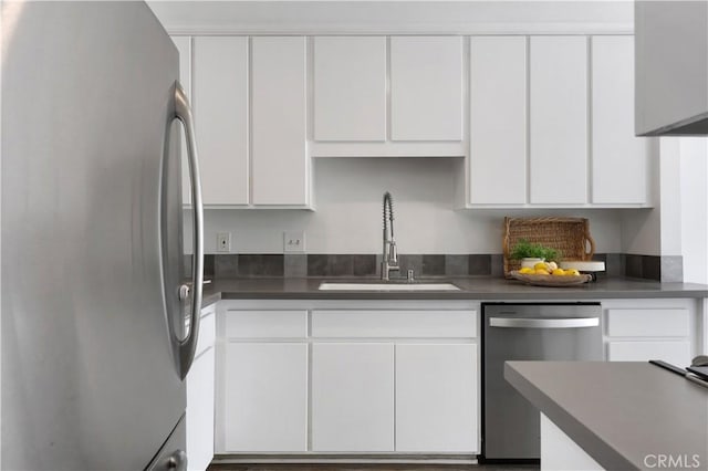 190 N Singingwood St Unit 1, Orange, CA 92869 - kitchen with stainless steel appliances, white cabinets, and dark countertops