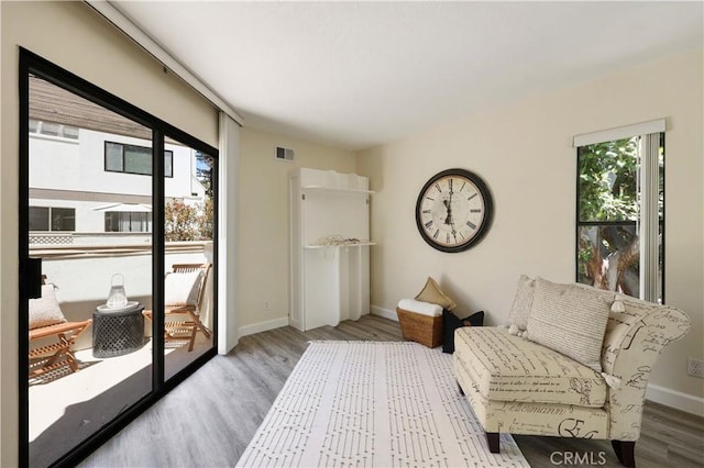 190 N Singingwood St Unit 1, Orange, CA 92869 - sitting room with wood finished floors and baseboards