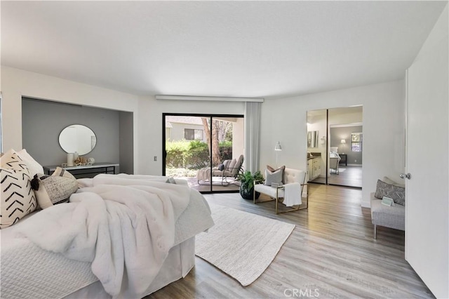190 N Singingwood St Unit 1, Orange, CA 92869 - bedroom with access to outside and wood finished floors