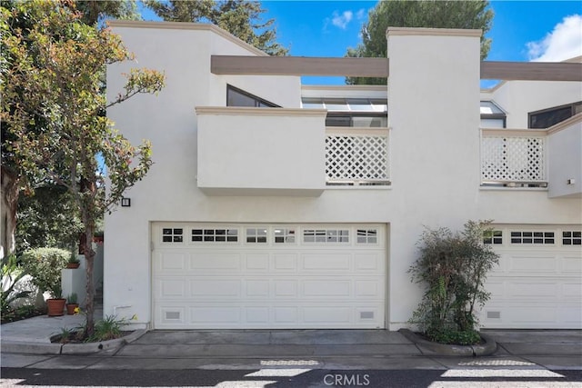 190 N Singingwood St Unit 1, Orange, CA 92869 - view of front of house with stucco siding and an attached garage