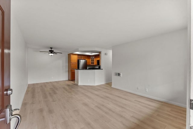 12590 Carmel Creek Rd Unit 1, San Diego, CA 92130 - unfurnished living room with ceiling fan, light wood-style flooring, and baseboards