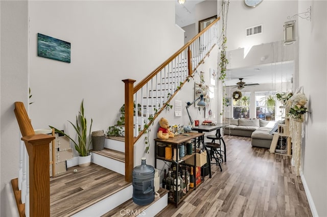 5 Quartz Ln, Ladera Ranch, CA 92694 - staircase with a high ceiling, wood finished floors, and a ceiling fan