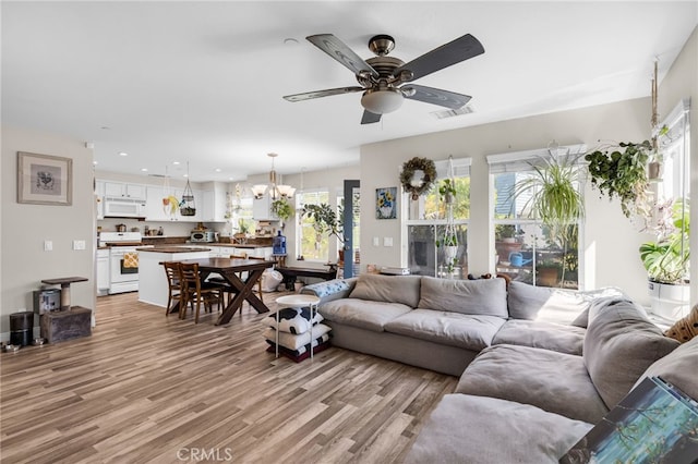 5 Quartz Ln, Ladera Ranch, CA 92694 - living area featuring a ceiling fan, light wood-style floors, a chandelier, and recessed lighting