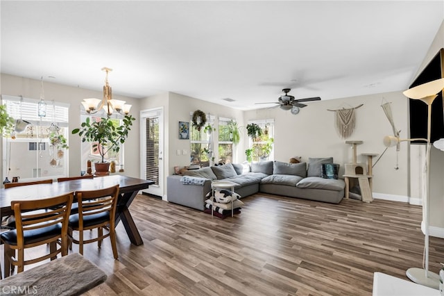 5 Quartz Ln, Ladera Ranch, CA 92694 - living area featuring wood finished floors, a chandelier, and a ceiling fan