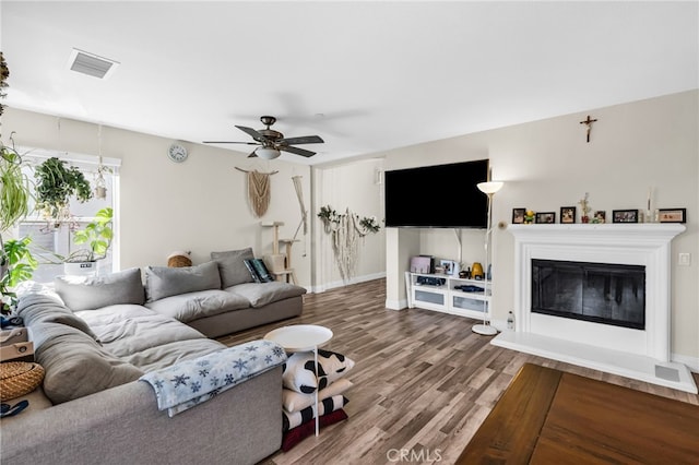 5 Quartz Ln, Ladera Ranch, CA 92694 - living area with wood finished floors, ceiling fan, and a glass covered fireplace