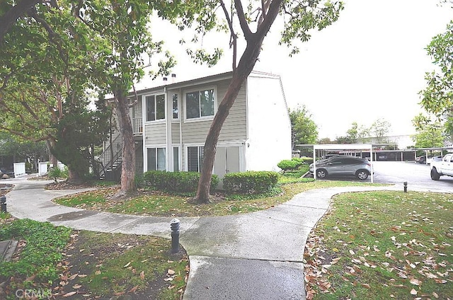 22224 S Vermont Ave Unit 102C, Torrance, CA 90502 - view of home's exterior featuring concrete driveway