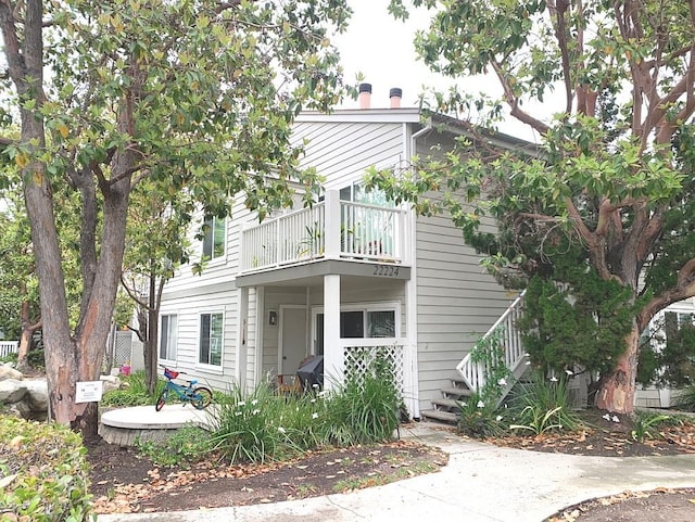 22224 S Vermont Ave Unit 102C, Torrance, CA 90502 - view of side of home featuring a balcony