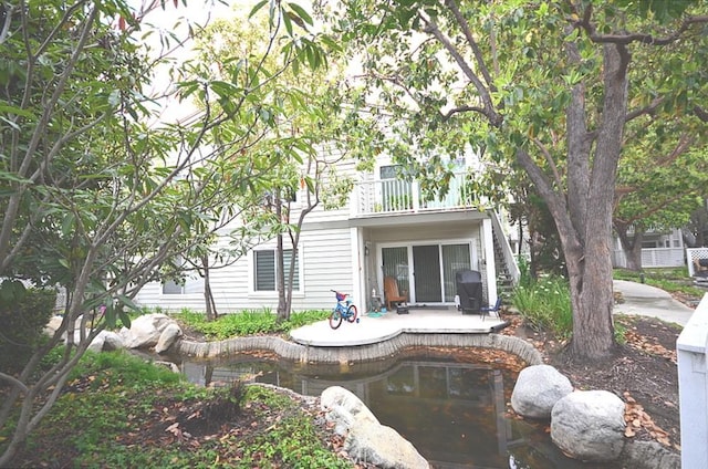 22224 S Vermont Ave Unit 102C, Torrance, CA 90502 - rear view of house with a balcony, a patio area, and stairway