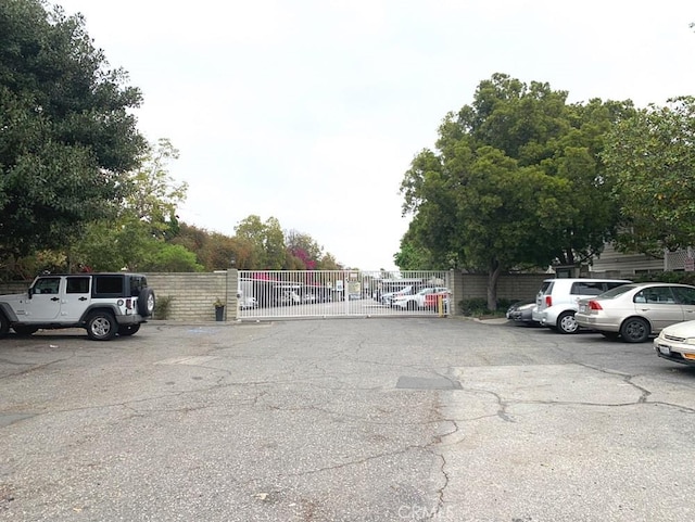 22224 S Vermont Ave Unit 102C, Torrance, CA 90502 - uncovered parking lot with a gate