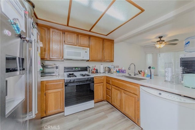 22224 S Vermont Ave Unit 102C, Torrance, CA 90502 - kitchen featuring white appliances, light countertops, light wood-style flooring, and ceiling fan