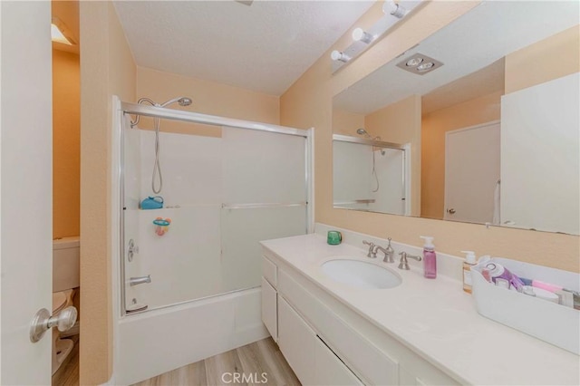 22224 S Vermont Ave Unit 102C, Torrance, CA 90502 - full bath with vanity, bath / shower combo with glass door, and wood finished floors