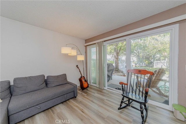 22224 S Vermont Ave Unit 102C, Torrance, CA 90502 - living room with wood finished floors and a textured ceiling