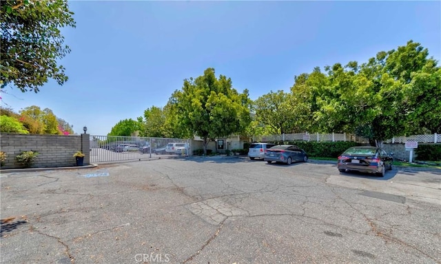 22224 S Vermont Ave Unit 102C, Torrance, CA 90502 - uncovered parking lot featuring a gate