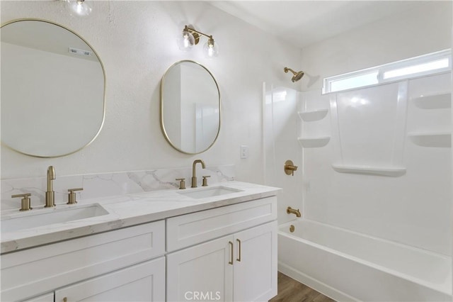 4415 12th St, Riverside, CA 92501 - full bathroom featuring double vanity, shower / washtub combination, and wood finished floors