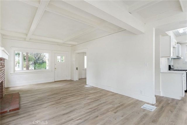 4415 12th St, Riverside, CA 92501 - unfurnished living room featuring coffered ceiling, light wood finished floors, a fireplace, beam ceiling, and baseboards